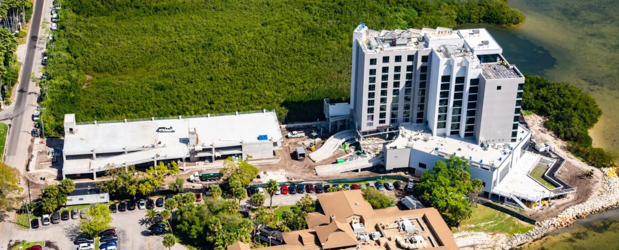 Wide aerial view of the Current Hotel next to the Tampa Bay